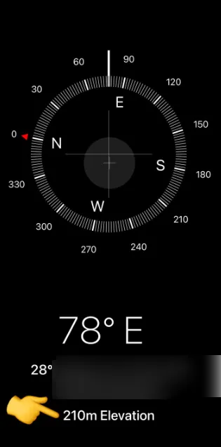 iPhone Compass app showing 210 m elevation at the bottom of the screen